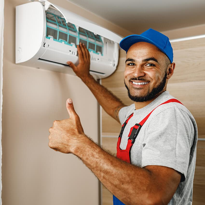 Technician repairing AC